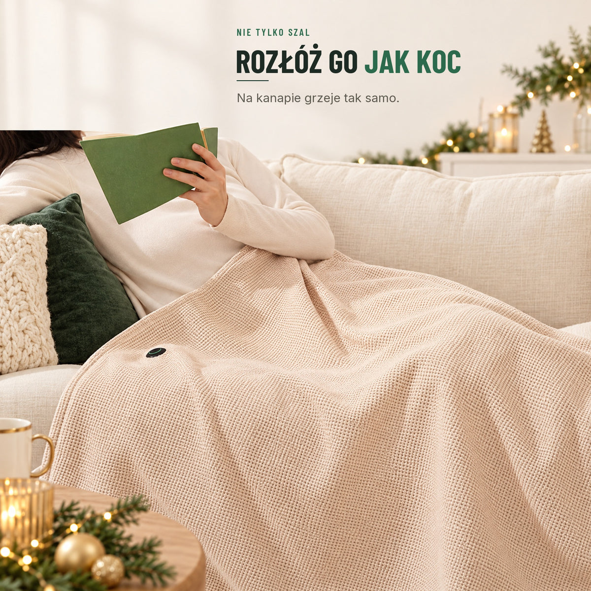 Ogrzewany szal rozłożony jak koc na kanapie